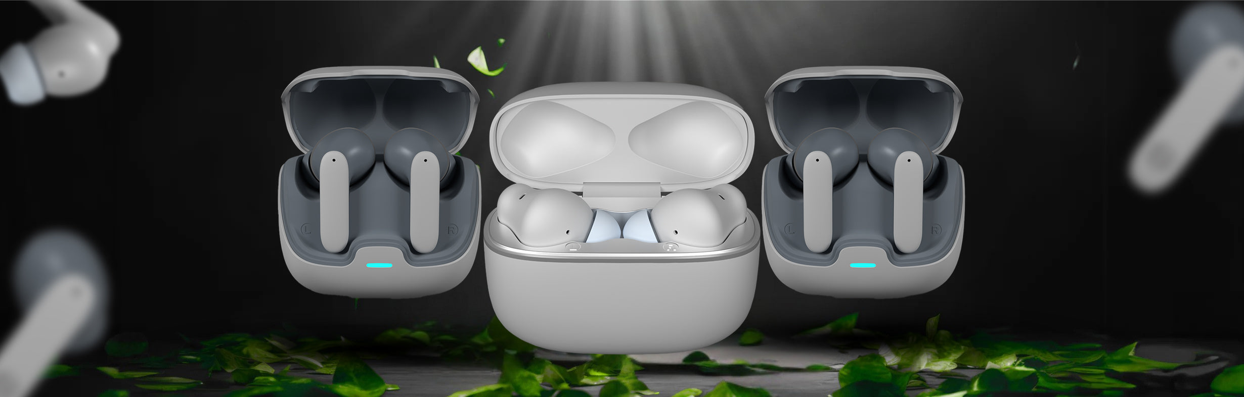 Three pairs of wireless earbuds in their charging cases on a dark background with green leaves. available in UK at Dellnux